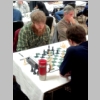 This is a photograph of Greater Knoxville Chess Club member Brad Phillis playing chess.