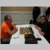 This is a photograph of Greater Knoxville Chess Club members Haskell Glover (L) and Robert Hydzik (R) at a chessboard.