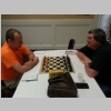 This is a photograph of Greater Knoxville Chess Club members Haskell Glover (L) and Robert Hydzik (R) at a chessboard.