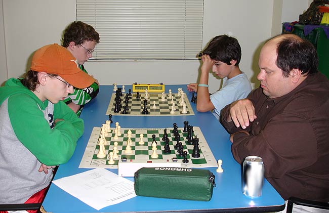 This is a photograph of a group of chess players