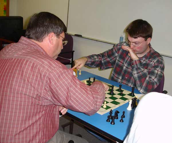This is a photograph of Bob Hydzik (L) and Kipp Bynum (R) playing chess.