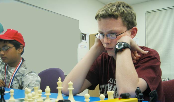 This is a photograph of Cory Marsh (R) and Sanchit Wadhawan (L)  playing chess.